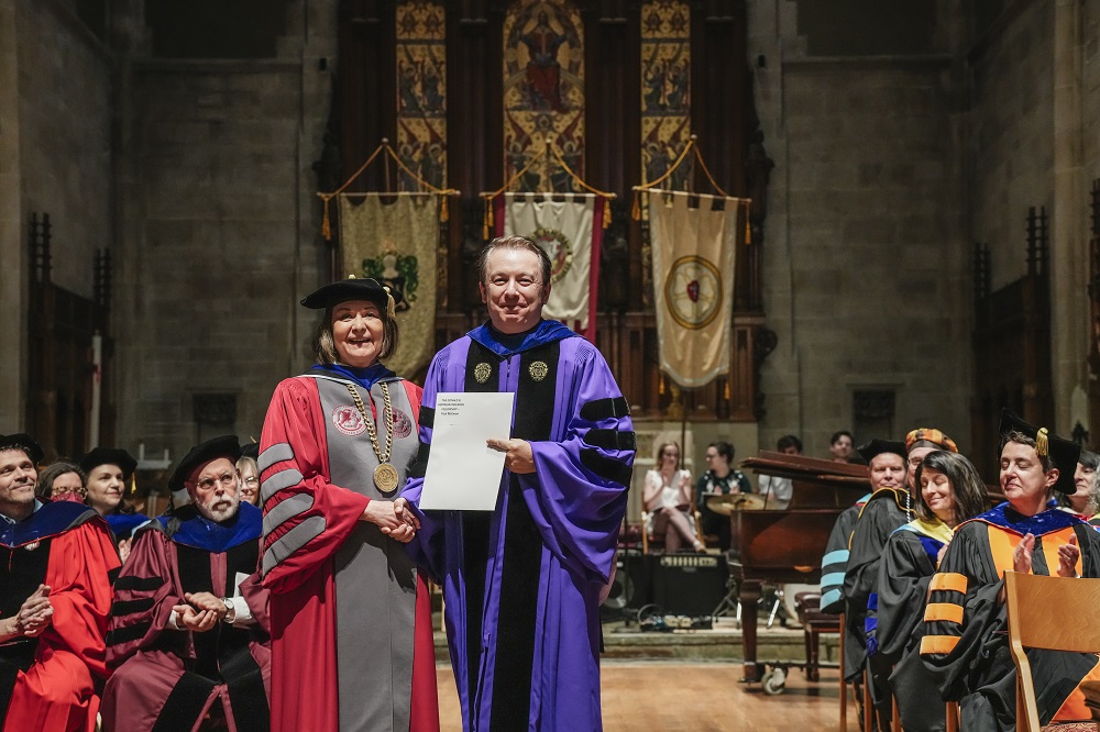 faculty accepted an award at Honors Convocation 2024